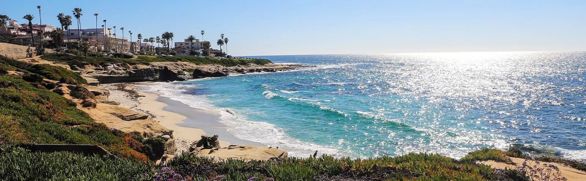 Solsken över stranden i San Diego